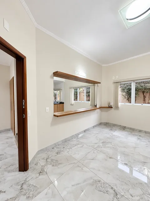 Sala com passa pratos, casa à venda no Condomínio Magnólias I em Araraquara